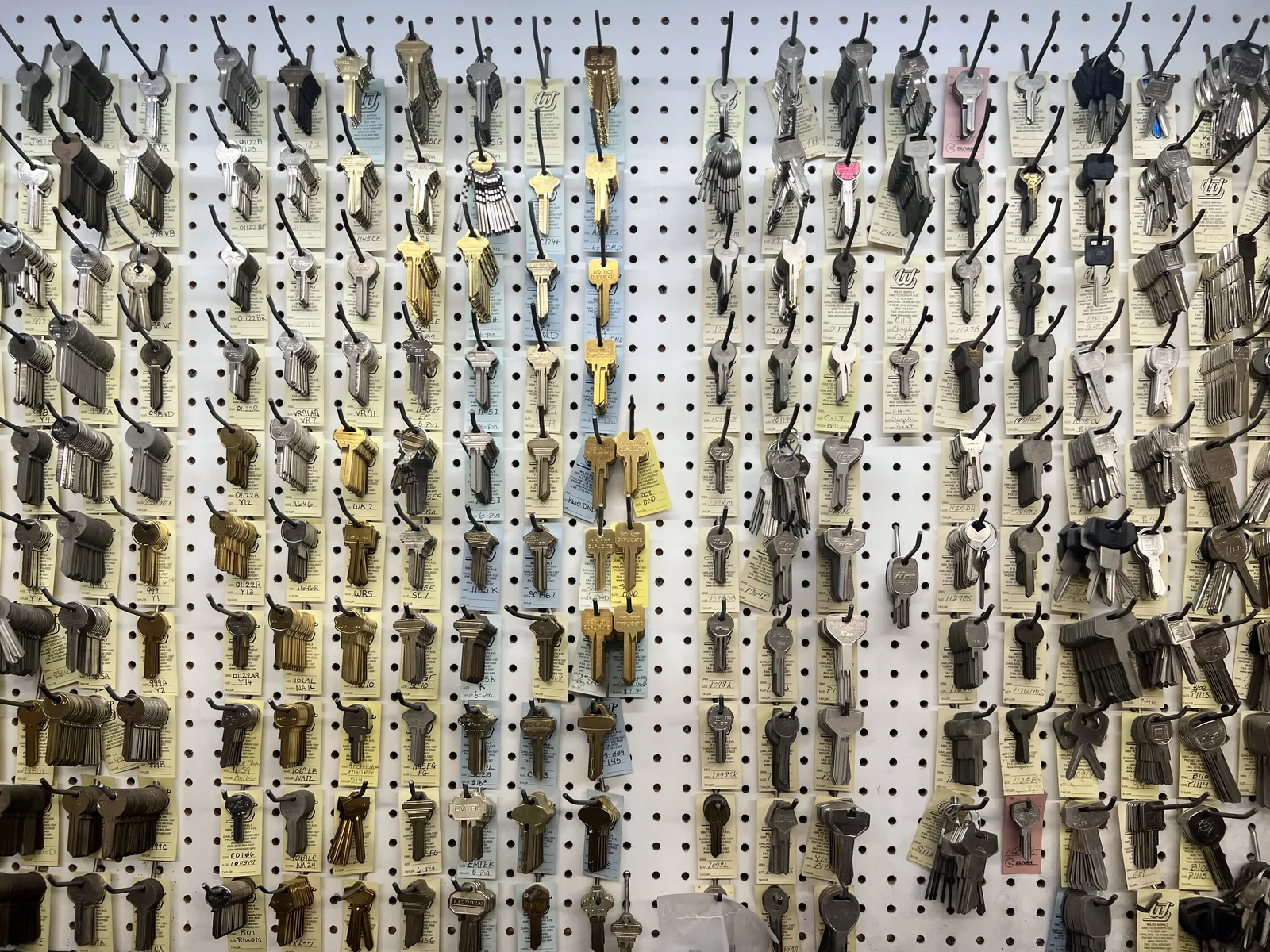 Wall of key blanks at Abe's Lock and Key locksmith shop